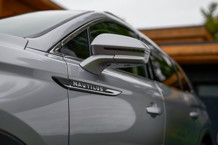 A close-up shot of a 2023 Lincoln Nautilus® SUV shows the driver’s side mirror