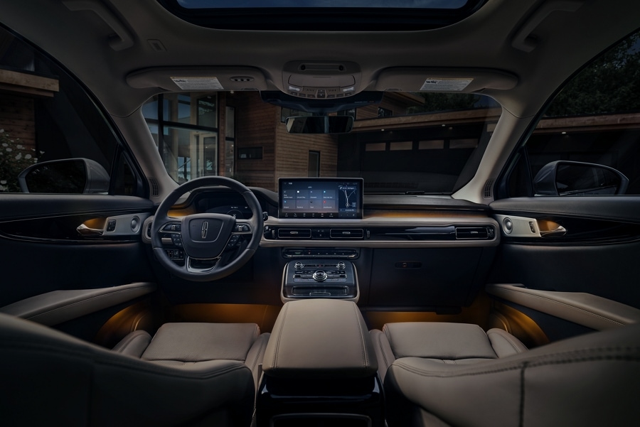 The orange ambient lighting inside a 2023 Lincoln Nautilus® SUV in Sandstone Interior creates a soft glow and relaxing mood