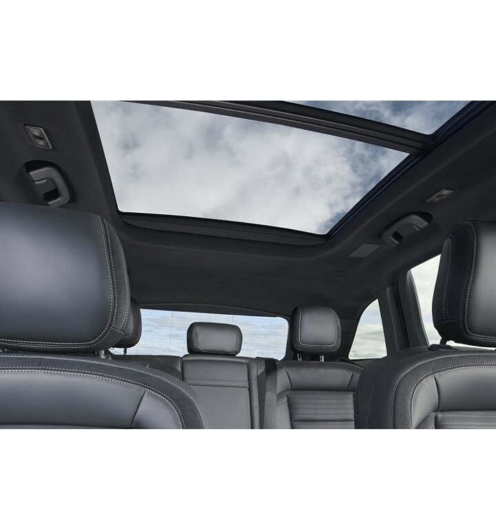 A spacious interior view of a 2024 Lincoln Nautilus® SUV from the front row to the second row