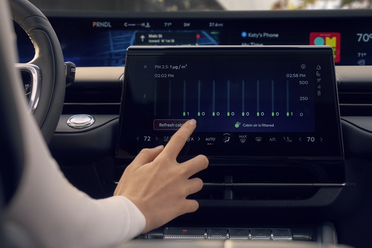 The driver of a 2025 Lincoln Nautilus uses the center touchscreen to adjust the settings of available Auto Air Refresh