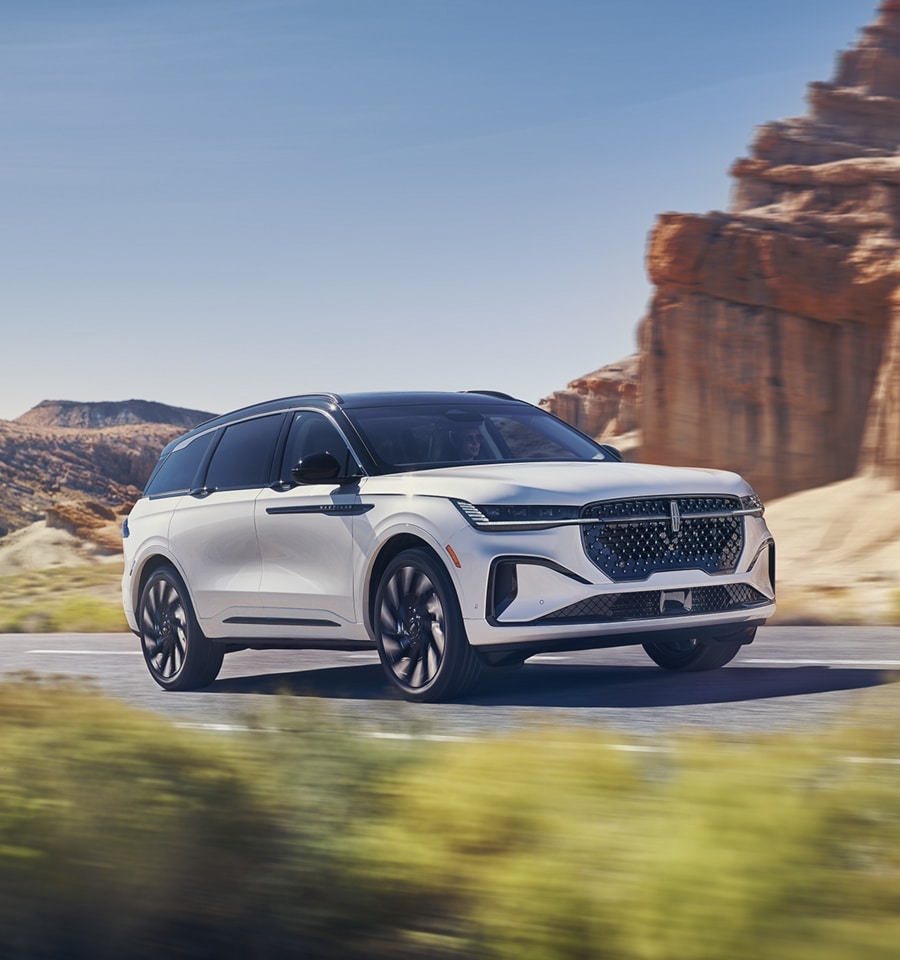 An all-new 2024 Lincoln Nautilus® SUV is being driven in a desert-like setting