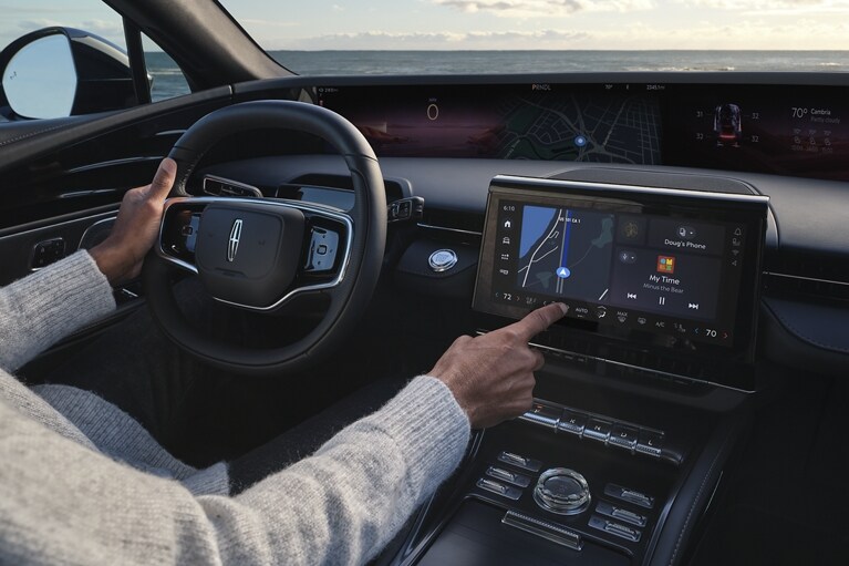 A person interacts with the center touchscreen of a 2025 Lincoln Nautilus® SUV