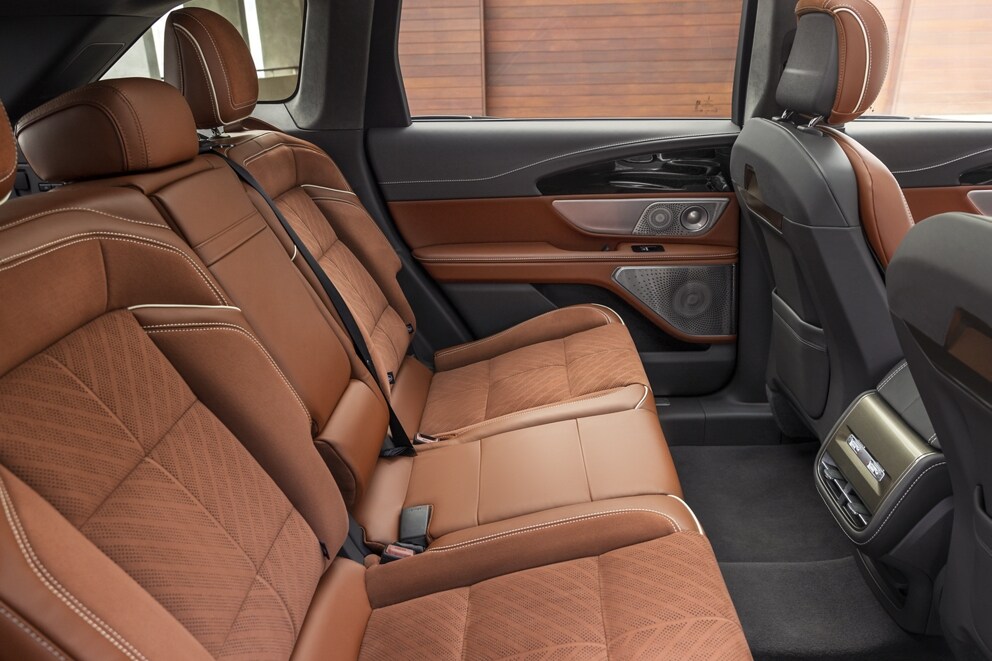 The spacious interior of a 2025 Lincoln Black Label Nautilus® SUV is shown in the redwood interior theme
