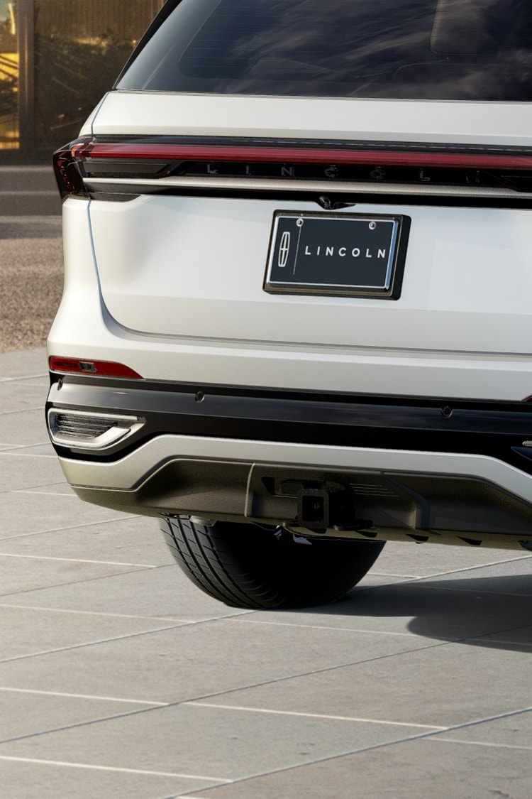 The rear tow hitch port of the Available Trailer Tow Class I Package is shown