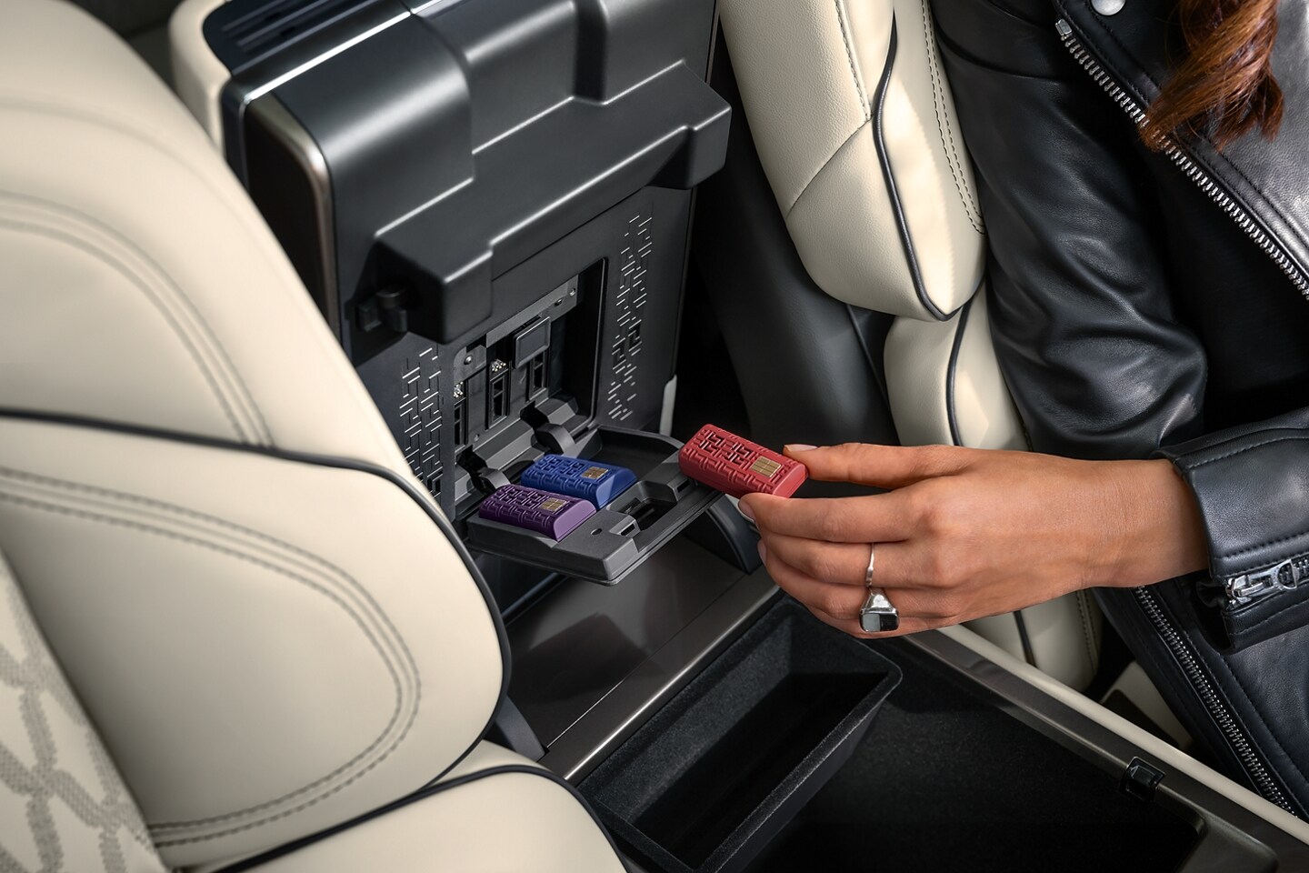 Digital Scent cartridges are shown inserted within the front armrest