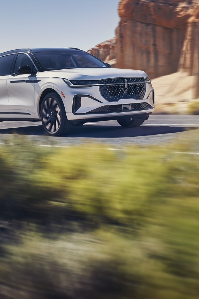 The 2025 Lincoln Nautilus® driving down a road in the desert