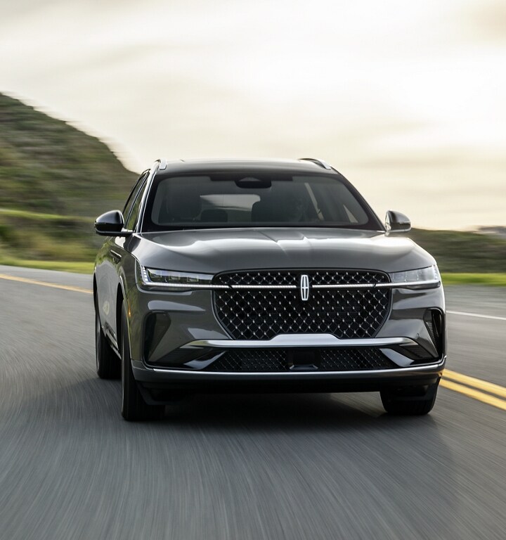 A 2026 Lincoln Black Label™ Nautilus® SUV is being driven on a coastal roadway