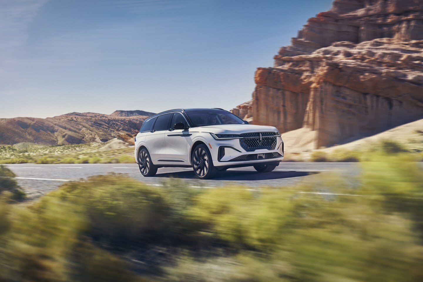 A 2026 Lincoln Nautilus® SUV is being driven on a remote roadway