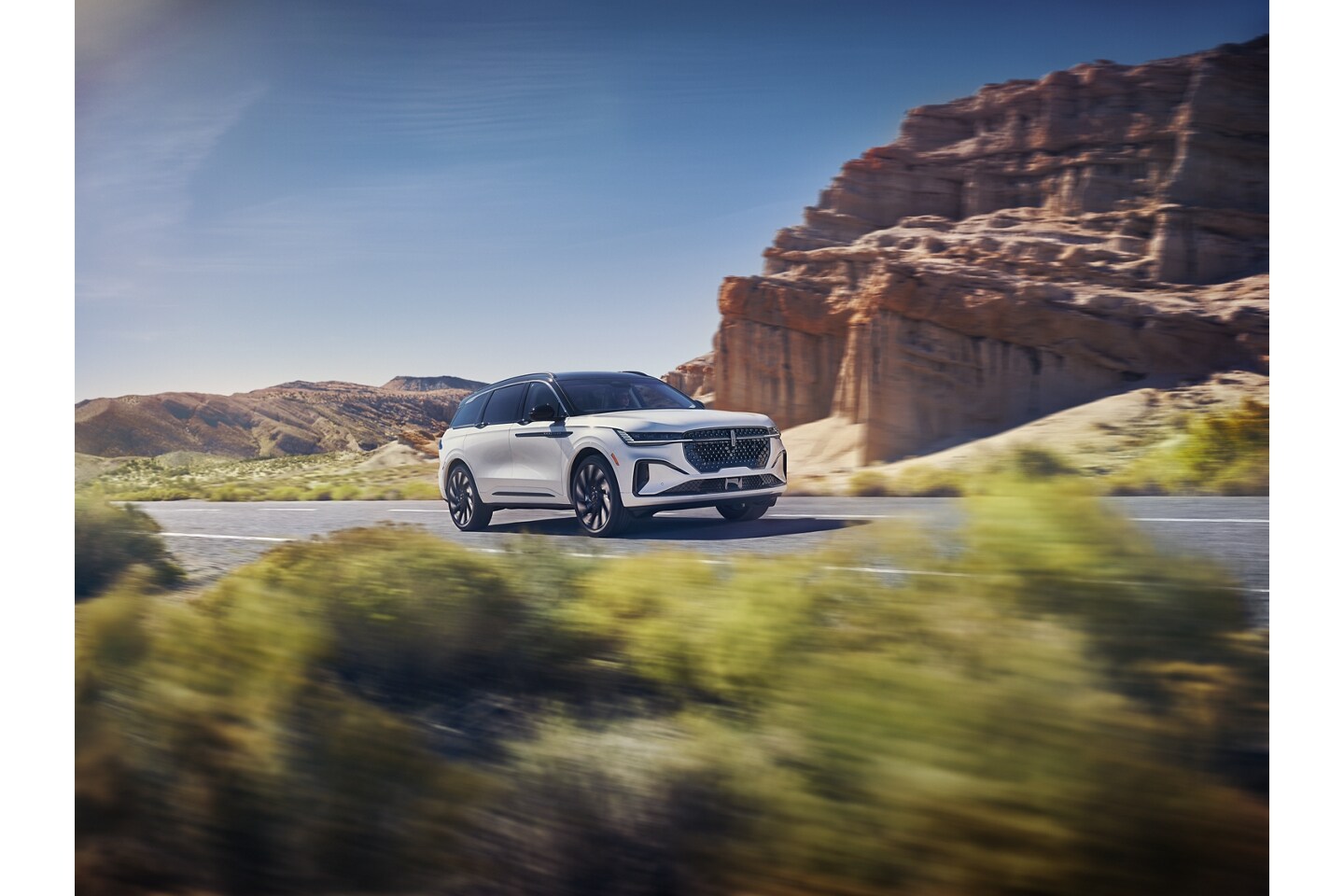 A 2026 Lincoln Nautilus® SUV is being driven on a remote roadway