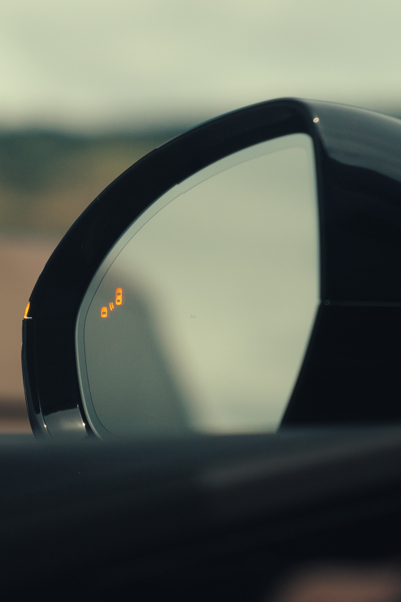 A 2026 Lincoln Nautilus® SUV mirror demonstrating the Blind Spot Information System