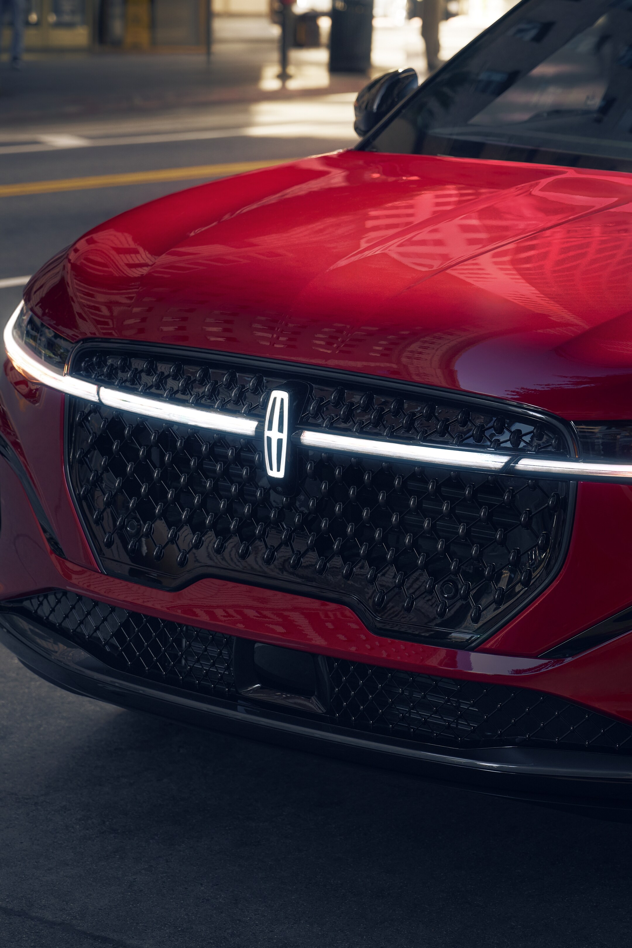 The front fascia of a 2026 Lincoln Nautilus® SUV highlights body-colored elements of the available Jet Appearance Package