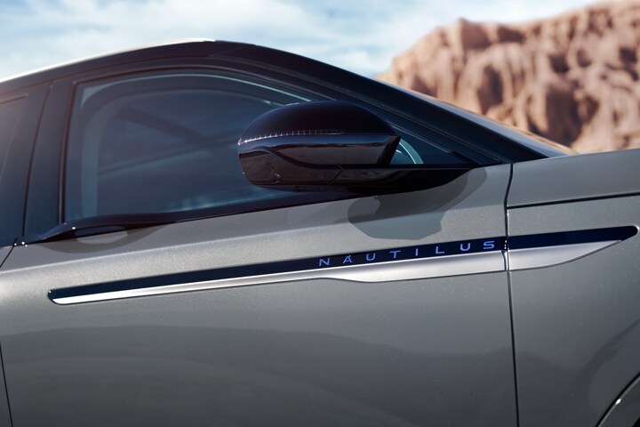 The fold in sideview mirrors of a 2026 Lincoln Nautilus® SUV