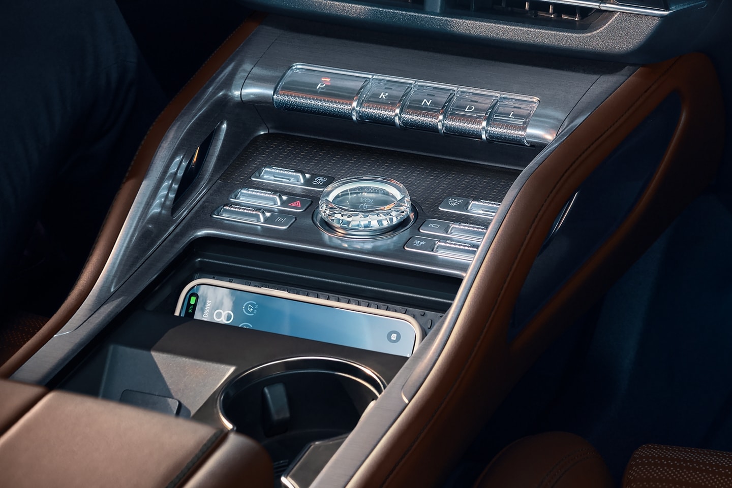 A mobile phone is being charged in media bin of a 2026 Lincoln Nautilus® SUV