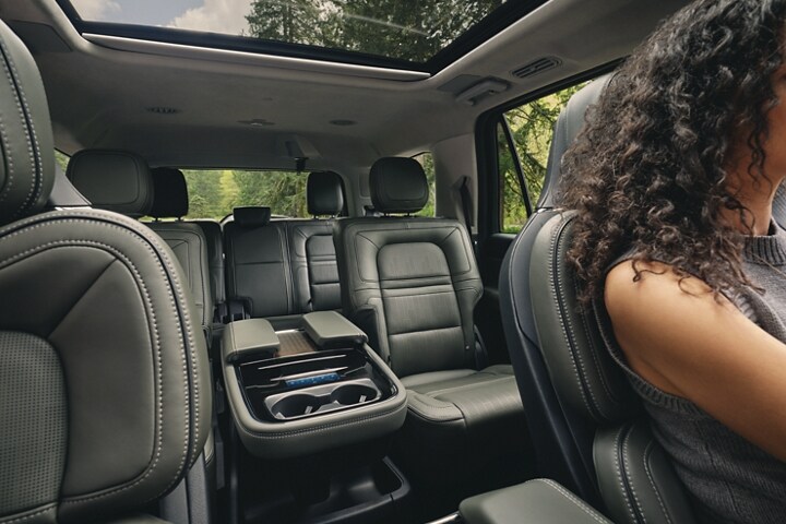 The spacious second and third rows of a 2023 Lincoln Black Label Navigator® SUV hint toward the promise of ample leg room.