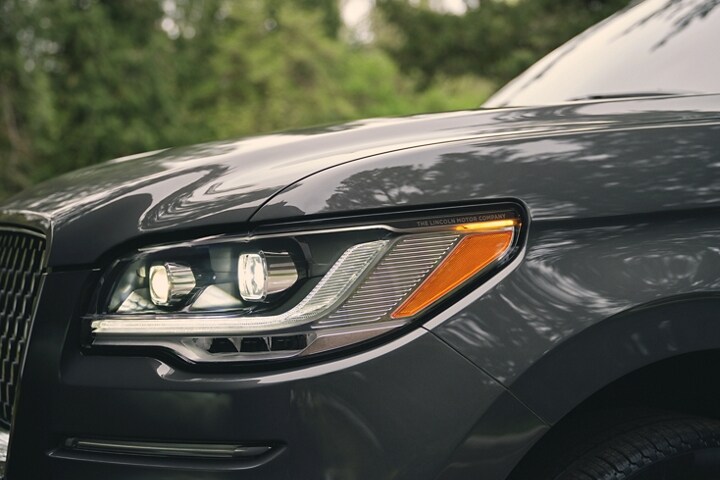 The LED headlamps on a 2023 Lincoln Black Label Navigator® SUV show dynamic lines and bold form.