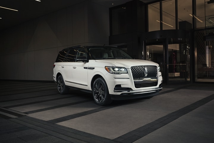 A 2023 Lincoln Black Label Special Edition Package model is parked outside of a luxury hotel and shows off bold, contrasting design.