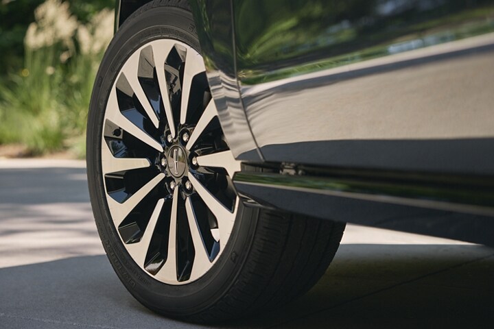 A detail shot of the 22-inch 12-spoke bright-machined aluminum wheels.