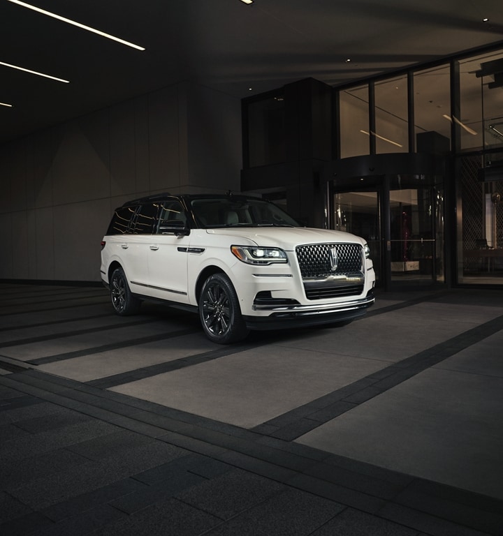 A 2024 Lincoln Black Label Special Edition Package model parked outside of a luxury and shows off bold, contrasting design.
