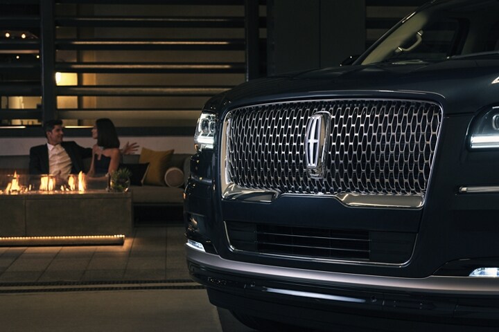 The grille design of a 2024 Lincoln Reserve Navigator® SUV shows off the illuminated Lincoln Star.
