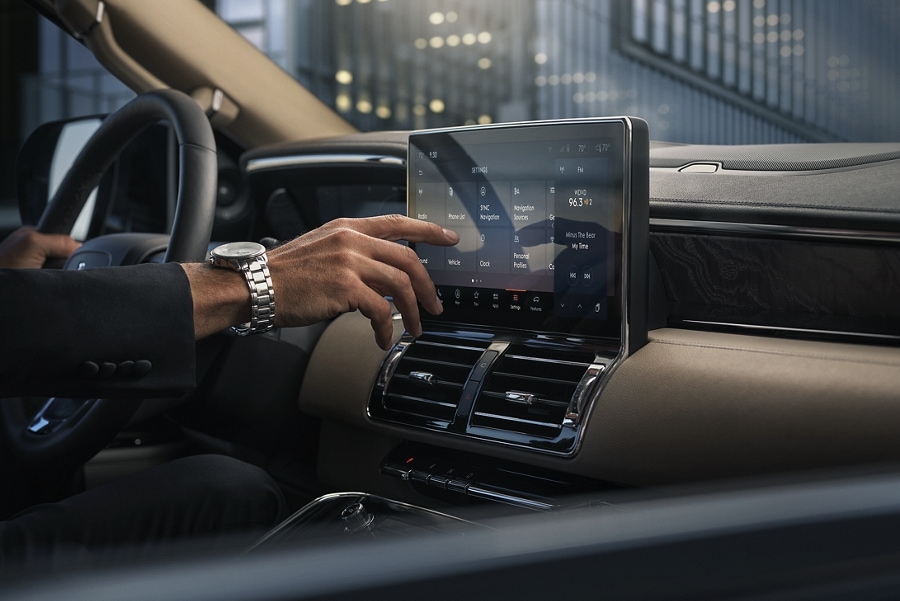 A hand is about to press the personal profiles tile on the settings screen