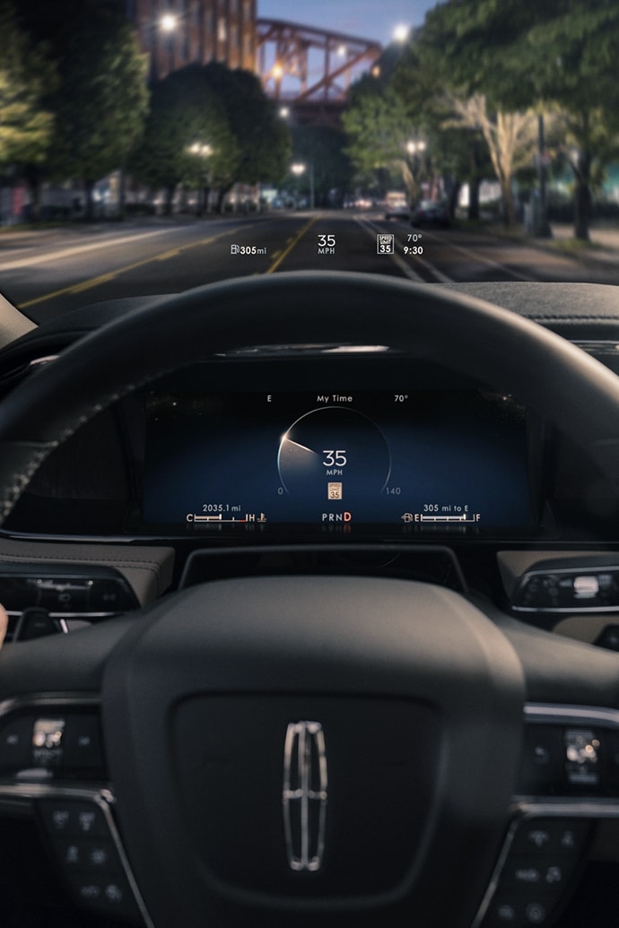 The head-up display projects basic driver information above the steering wheel