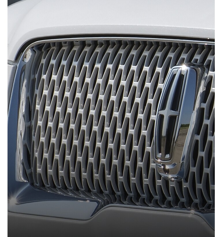 A 2024 Lincoln Navigator® SUV grille is shown that is available with the monochromatic package
