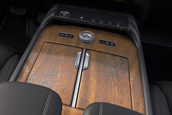 Khaya real-wood appliqué of the Invitation theme on the center console of a 2025 Lincoln Black Label Navigator® SUV