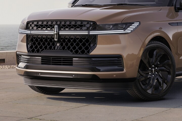 A 2025 Lincoln Navigator® SUV is parked at a scenic ocean-side overlook