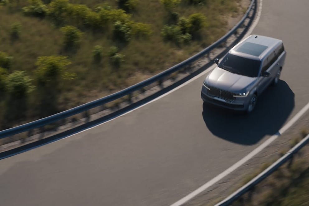 A 2025 Lincoln Navigator® SUV uses an entrance ramp to Blue Zone highway where hands-free highway driving is possible